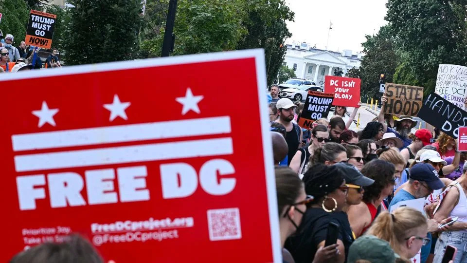 People rally in opposition to President Donald Trump's plans to activate federal law enforcement in Washington, DC, on Monday. - Mandel Ngan/AFP/Getty Images