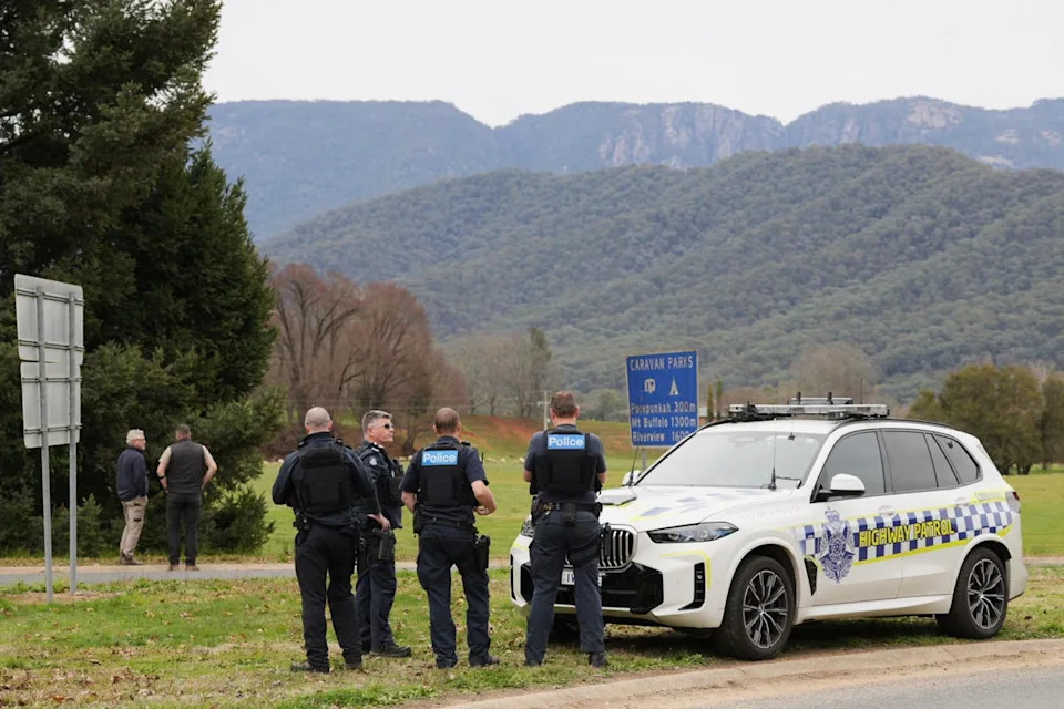 Police wait near the scene of a shooting in the high country of Porepunkah in the state of Victoria, Australia, Tuesday, 26 August 2025 (AAP)