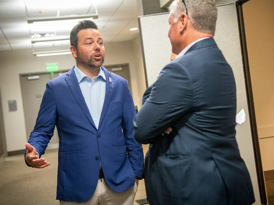 Lt. Gov. Micah Beckwith speaks with Rick Wajda, chief executive officer of the Indiana Builders Association at their event at the Monroe Convention Center on Thursday, Aug. 21, 2025.