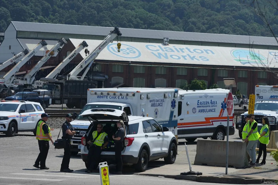 Emergency crews gather after an explosion at the Clairton Coke Works, a U.S. Steel coking plant, Monday, Aug 11, 2025, in Clairton, Penn. (AP Photo/Gene Puskar)