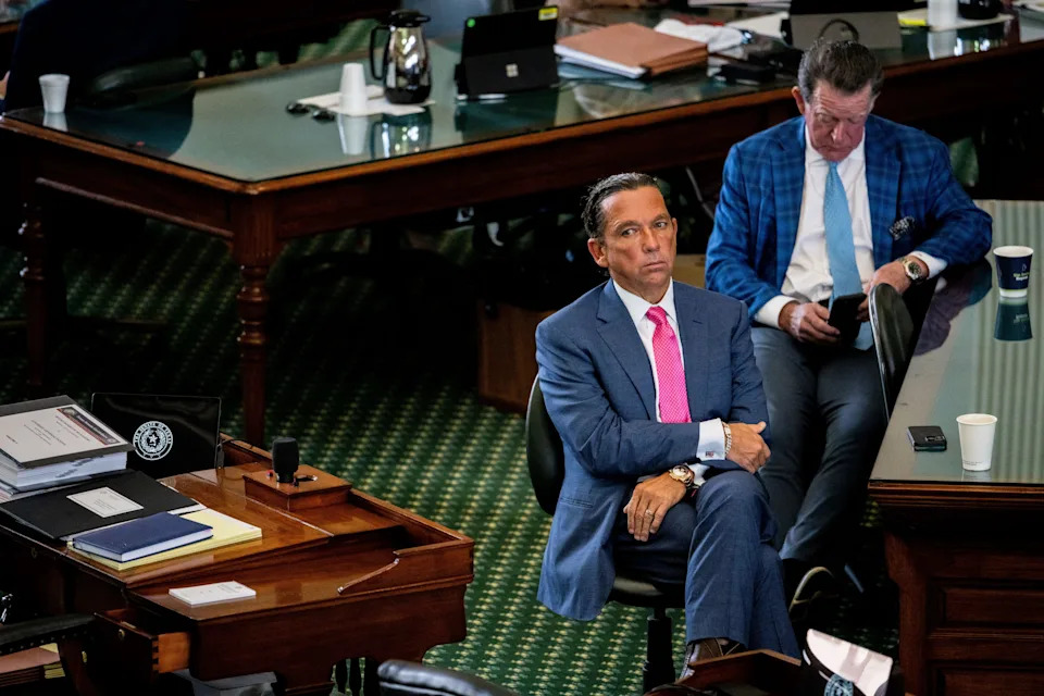Defense attorneys Tony Buzbee, sitting at the forefront, and Dan Cogdell wait together ahead of former Texas Attorney General Ken Paxton's impeachment trial at the Texas Capitol on Sept. 16, 2023, in Austin.