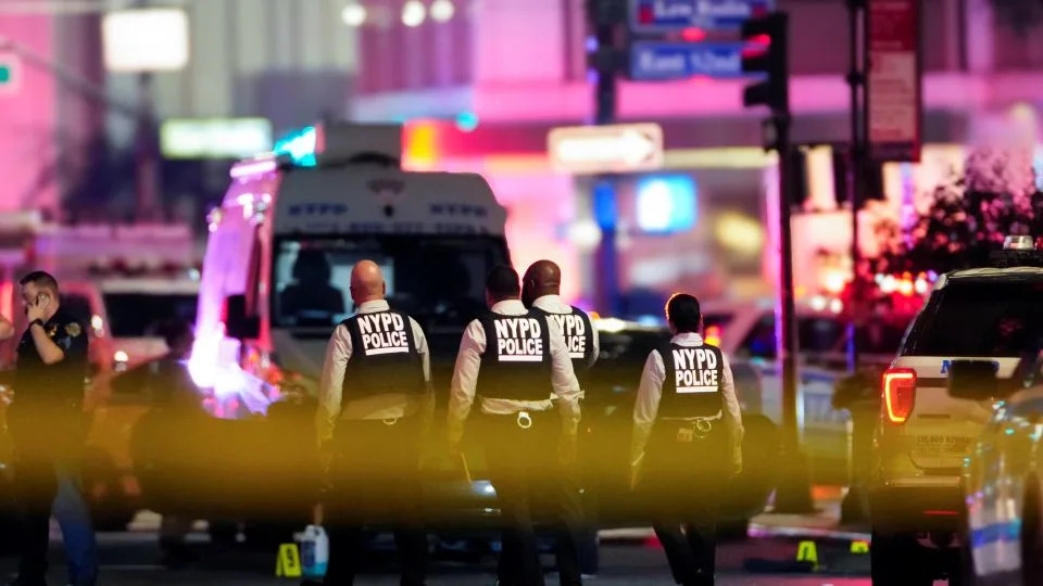 NYPD officers work near the scene of shooting in Manhattan Monday. - Eduardo Munoz/Reuters