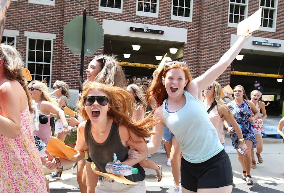 New sorority members run to their houses during the University of Alabama's Formal Sorority Recruitment Bid Day on Sorority Row in Tuscaloosa, Ala. on Saturday, Aug. 13, 2016. More than 2,600 students participated in recruitment, with the largest recruitment class in the nation, and 2,488 received bids from the 16 participating Panhellenic sororities.  Staff Photo/Erin Nelson