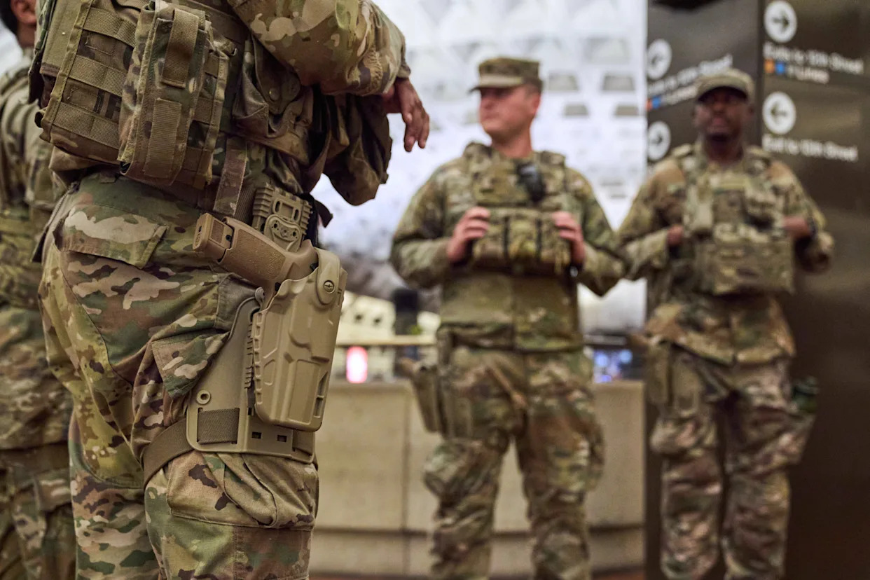 Photos of week three of Washington's federal takeover, as troops on patrol start carrying guns