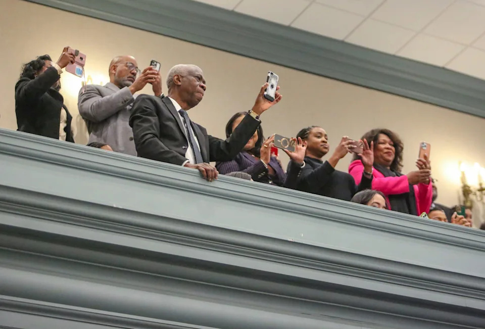 Guests in the gallery applaud and video record as Representative Melissa Minor-Brown is elected Speaker of the House on the first day of the legislative session of the 153rd General Assembly at Legislative Hall in Dover, Tuesday, Jan. 14, 2025.