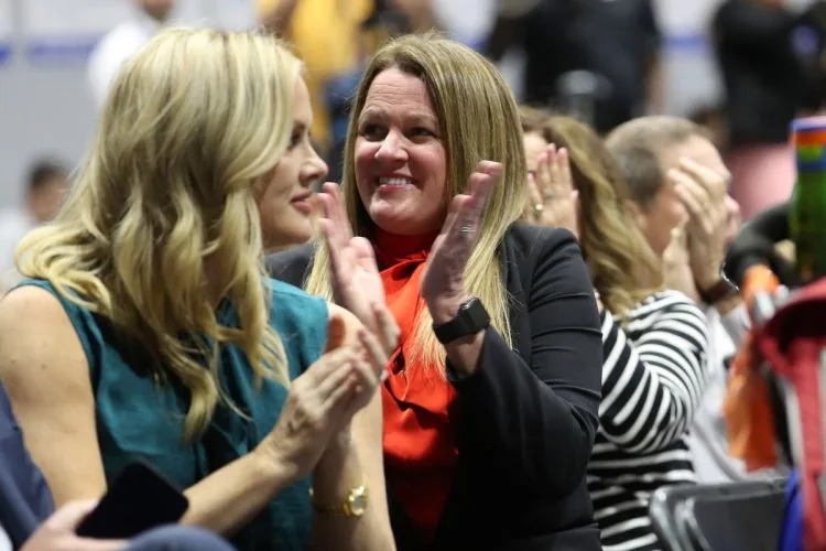 Conroe school board members Tiffany Nelson, left, and Melissa Dungan, attended a February event where Republican Gov. Greg Abbott promoted voucher legislation, which passed in May. Their district is one of the largest in the state to adopt the Bluebonnet curriculum. (Jason Fochtman/Houston Chronicle via Getty Images)