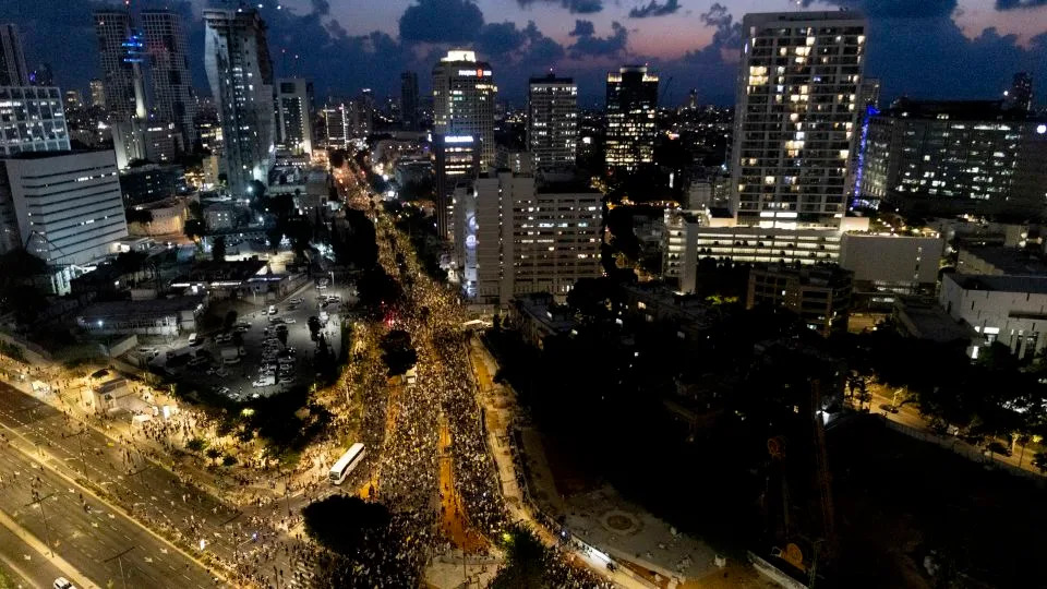 Protesters march during a rally calling for the Israeli government to sign a deal to release the hostages held in Gaza, on Tuesday, in Tel Aviv, Israel. - Amir Levy/Getty Images