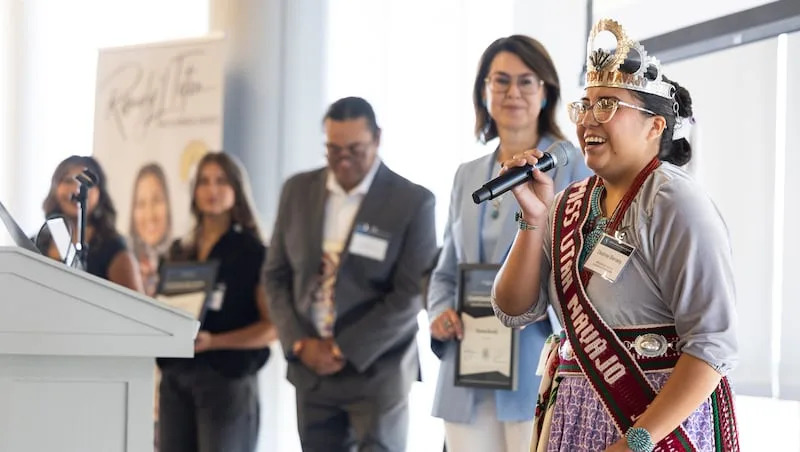 Desiree Benally speaks as she accepts the award for cultural preservation and promotion during the Indigenous Youth Leadership Program Changemaker Awards ceremony during the opening session of the youth track of the 2025 Utah Native American Summit at Utah Valley University in Orem on Friday, Aug. 1, 2025.