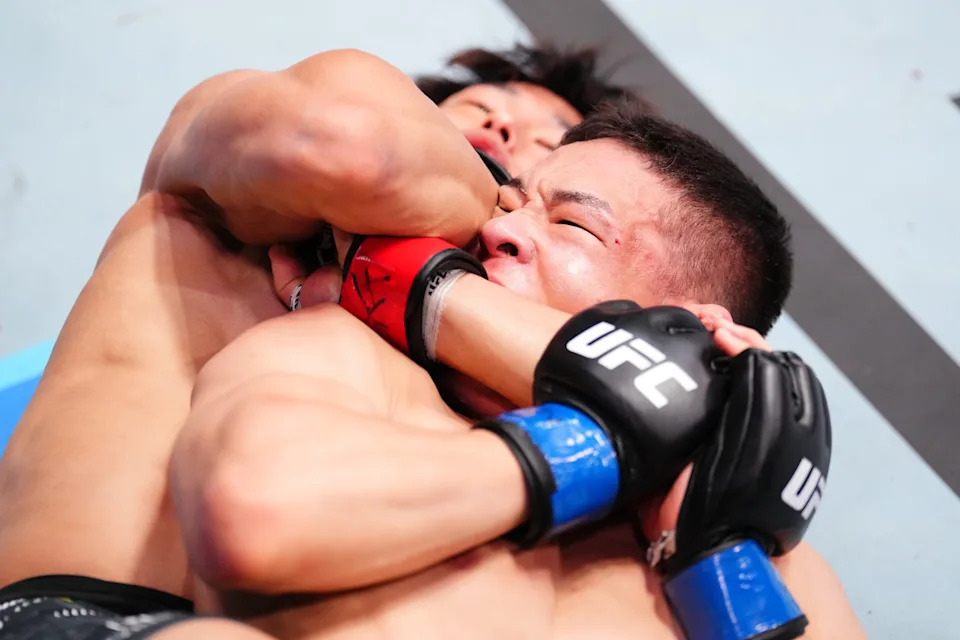 LAS VEGAS, NEVADA - AUGUST 02: (L-R) Tatsuro Taira of Japan secures a submission against HyunSung Park of South Korea in a flyweight fight during the UFC Fight Night event at UFC APEX on August 02, 2025 in Las Vegas, Nevada. (Photo by Chris Unger/Zuffa LLC)
