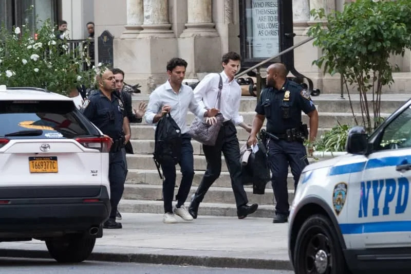 New York Police Department Officers guide employees, with hands raised, to safety due to an active shooter at 345 Park Ave in New York City. A police officer and two civilians were shot. Derek French/SOPA Images via ZUMA Press Wire/dpa