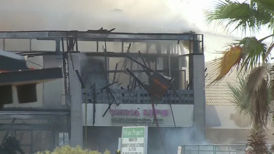 Clark County fire crews battle a large blaze at a business complex across the street from the UNLV campus on Maryland Parkway, near Tropicana Avenue on July 25, 2025. (KLAS)