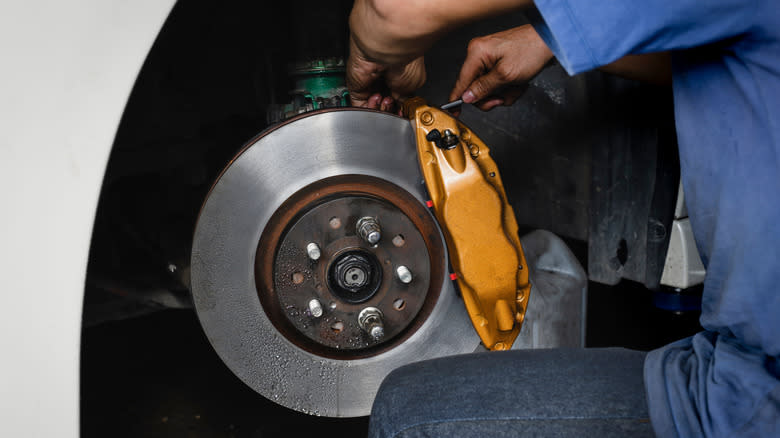 A mechanic performing brake bleeding