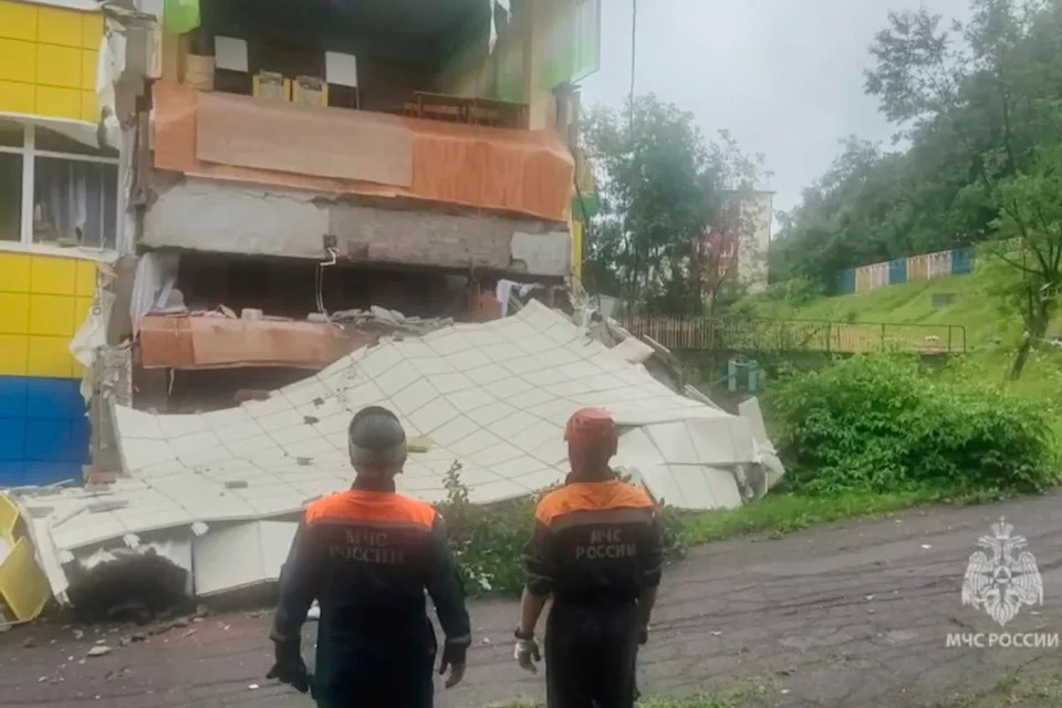 Emergency services personnel inspect a kindergarten damaged by the earthquake in Petropavlovsk-Kamchatsky, Russia, on Wednesday (AP)