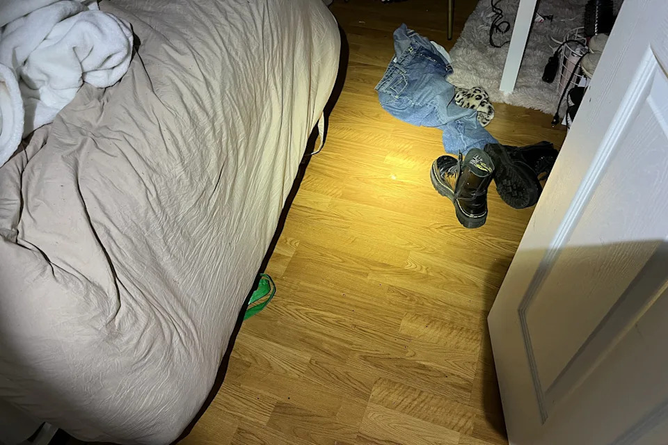 Showing leading into the room Kaylee/Maddie were in, but just see door, end of bed and shoes on the floor/blanket on chair. (Moscow Police Department)