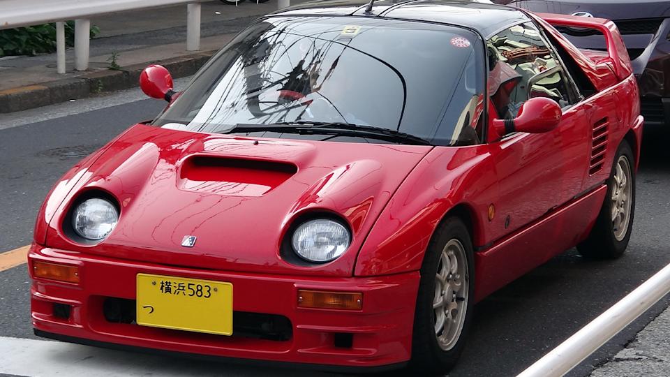 Autozam AZ-1, front 3/4 view, red exterior, on the road