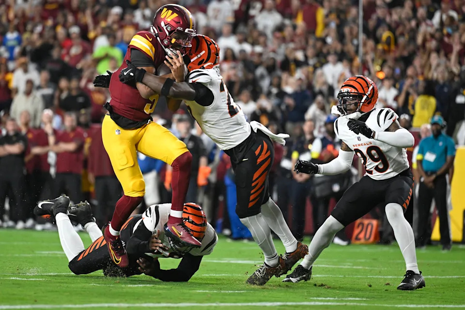 LANDOVER, MD - AUGUST 18: Washington Commanders quarterback Jayden Daniels scores a first quarter touchdown during a preseason game against the Cincinnati Bengals at the Northwest Stadium in Landover, MD on August 18, 2025. (Photo by John McDonnell/ for The Washington Post via Getty Images)
