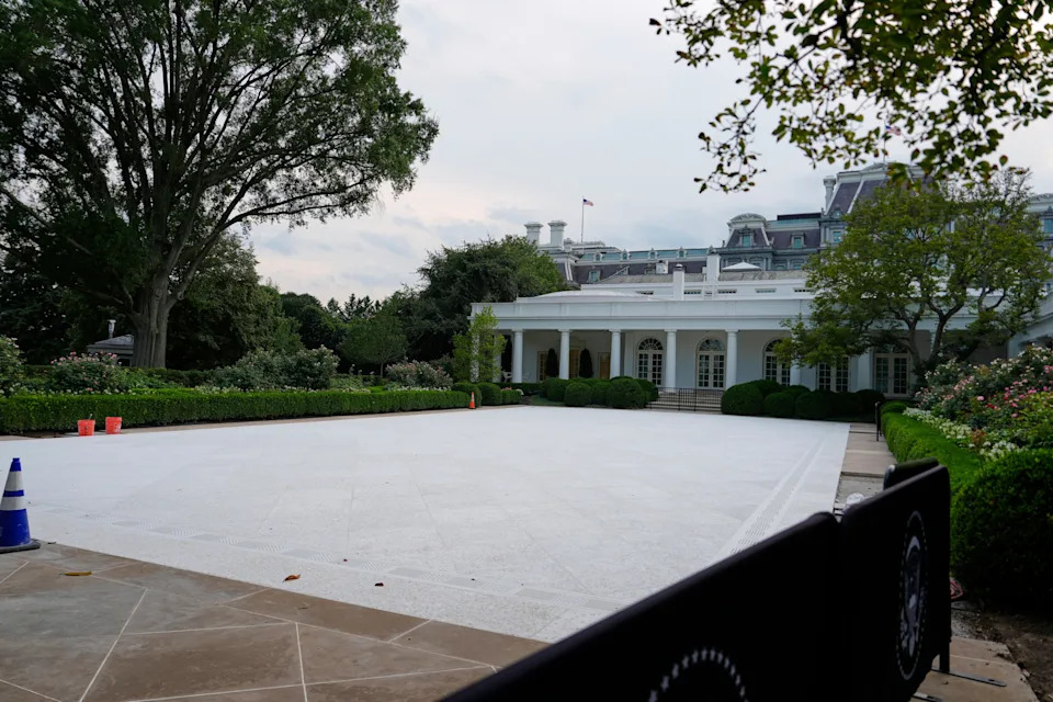 Wide view of the White House's South Portico with a newly paved, empty area and surrounding greenery