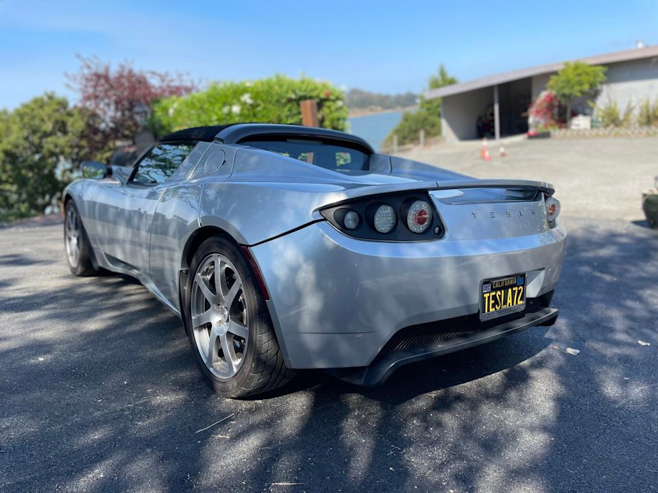 The back of a silver 2008 Tesla Roadster