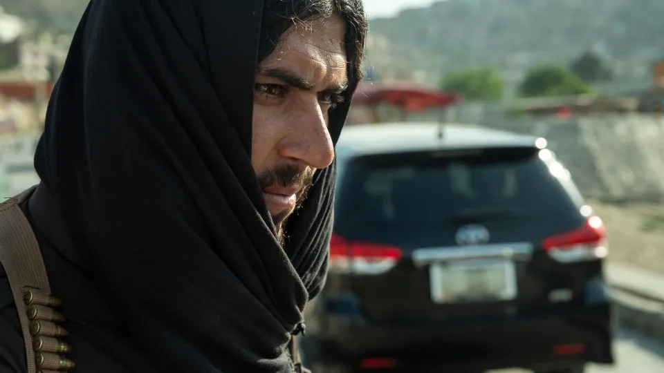 A Taliban security officer mans a checkpoint in Kabul, Afghanistan, in June. - Mick Krever/CNN