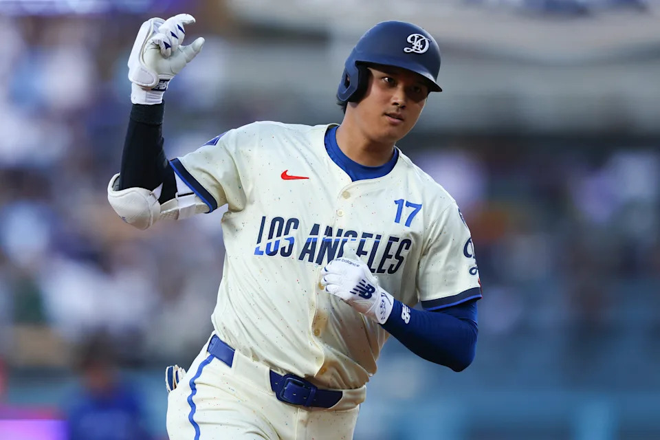 Los Angeles Dodgers' Shohei Ohtani gestures while running the bases after hitting a home run during the fifth inning of a baseball game against the Toronto Blue Jays, Saturday, Aug. 9, 2025, in Los Angeles. (AP Photo/Jessie Alcheh)