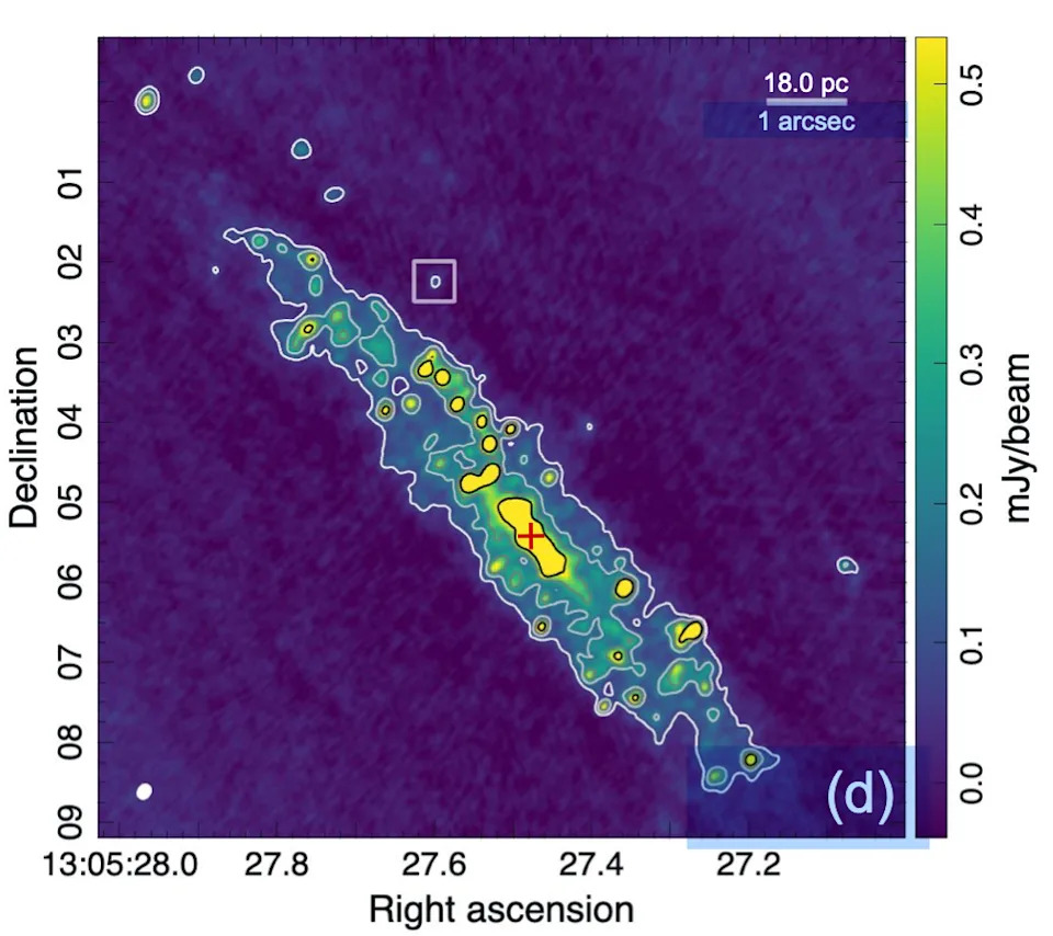 A heat map of the spiral galaxy NG 4945, with a box around a small blue dot showing Punctum, the unknown object