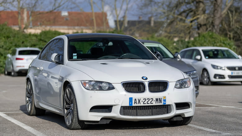 View on a white BMW M3 E92 parked on a parking lot.