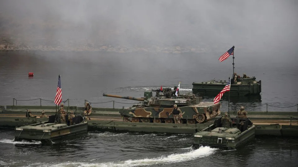 A South Korean army tank is moved on a pontoon bridge during a US-South Korea joint river-crossing exercise which is a part of the annual Freedom Shield joint military training, near the demilitarized zone separating the two Koreas in Yeoncheon, South Korea, March 20, 2025. - Kim Hong-Ji/Reuters