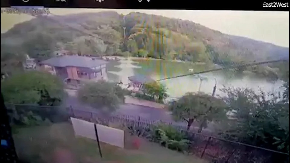 surveillance footage of chairlift splashing into lake