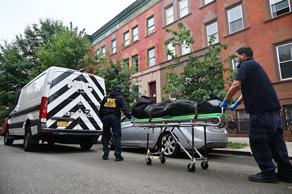 Members of the New York City Office of Chief Medical Examiner remove the body of Influencer model Donald Zieben-Hood in Harlem, New York, on Aug. 1. (Kyle Mazza / NurPhoto/Shutterstock)