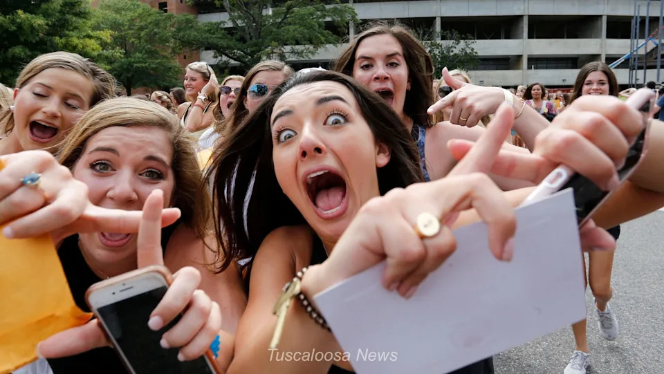 New sorority sisters join their sororities on Bid Day Sunday, August 19, 2018 on Sorority Row outside Bryant-Denny Stadium. New members of Chi Omega show their excitement as they run down the street to their sorority house. [Staff Photo/Gary Cosby Jr.]This is the craziest thing I have ever photographed. Who knew young women got so excited about joining a sorority. I just got in the way, hoped not to get run over, and made pictures. That's what I do best, really. I mean, get in the way. I am very good at getting in the way!