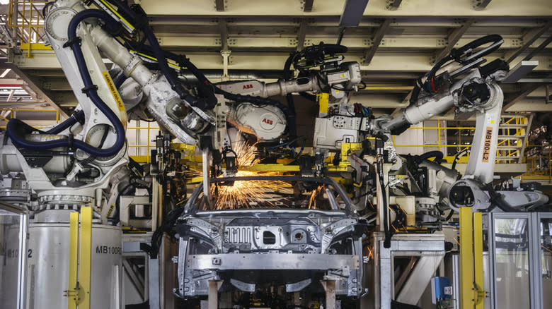 Robots welding a car body