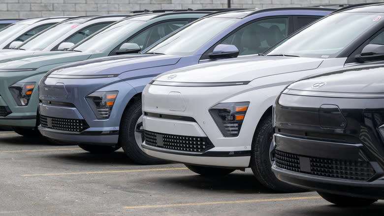 A row of Hyundai EUV sporty vehicles, on the parking lot of a car dealership.