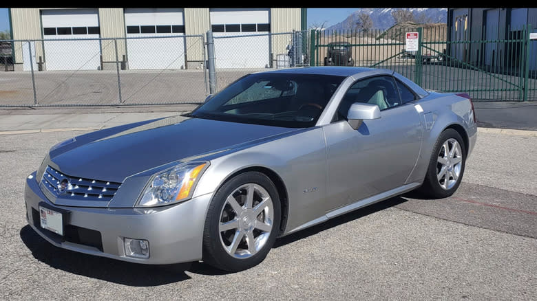 a 2006 Cadillac XLR Convertible in silver parked in a parking lot