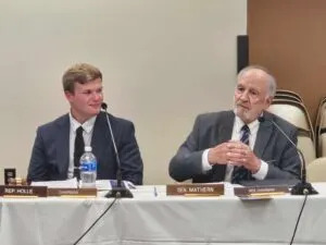  Rep. Dawson Holle, R-Mandan, chair of the North Dakota Tribal and State Relations Committee, listens as the vice chair, Sen. Tim Mathern, D-Fargo, speaks Aug. 19, 2025, at Dakota Magic Casino near Hankinson, North Dakota. (Photo by Jeff Beach/North Dakota Monitor)