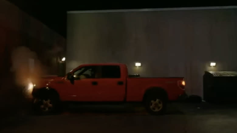 Jackie Daytona's red ram truck drives into the wall of his bar