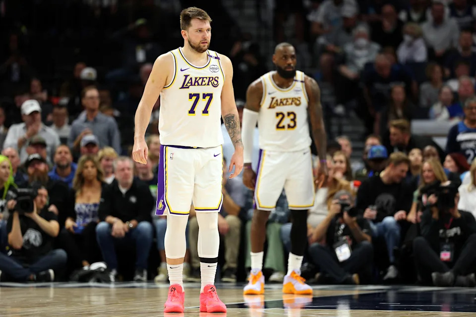 MINNEAPOLIS, MINNESOTA - APRIL 27: Luka Doncic #77 and LeBron James #23 of the Los Angeles Lakers look on against the Minnesota Timberwolves in the third quarter of Game Four of the First Round of the 2025 NBA Playoffs at Target Center on April 27, 2025 in Minneapolis, Minnesota. The Timberwolves defeated the Lakers 116-113 to take a 3-1 series lead. NOTE TO USER: User expressly acknowledges and agrees that, by downloading and or using this photograph, User is consenting to the terms and conditions of the Getty Images License Agreement. (Photo by David Berding/Getty Images)