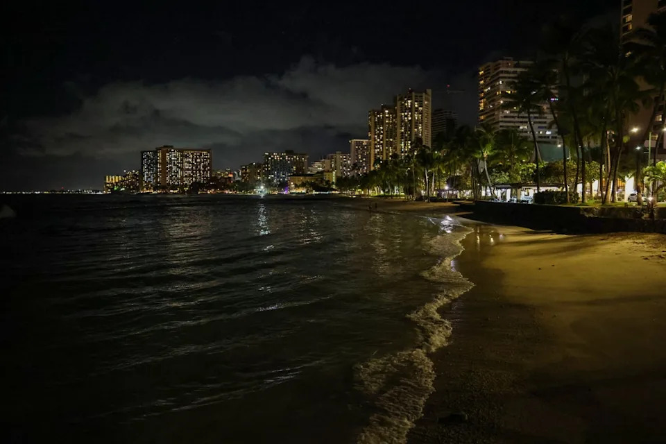 Waves roll on to an empty Waikiki Beach on Tuesday evening in Honolulu, Hawaii, with parts of Alaska and the U.S. West Coast under tsnumai warnings (Getty Images)