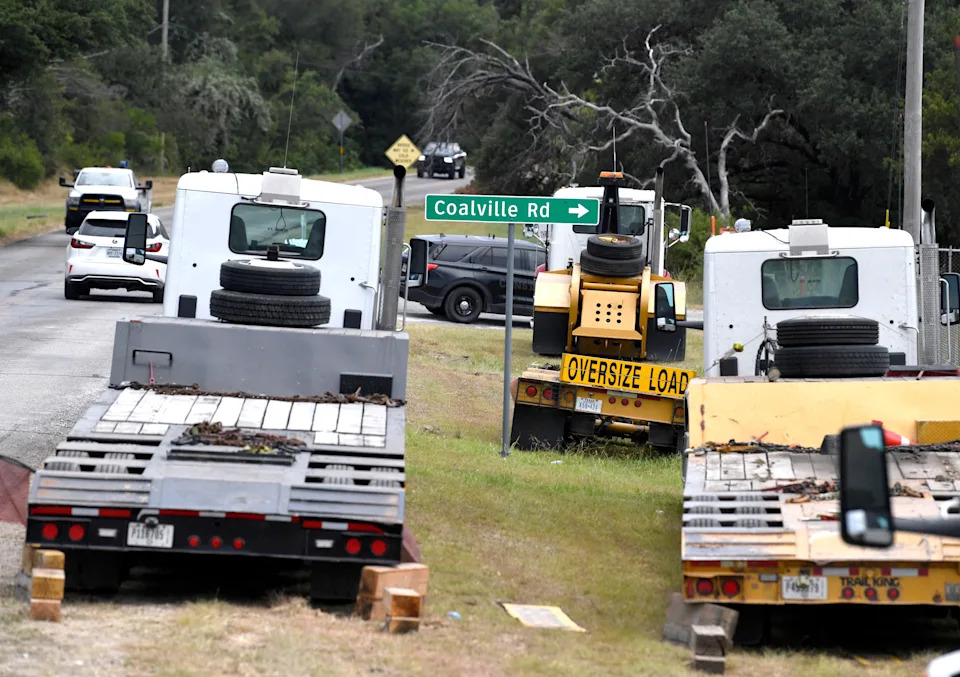 Trailers are lined up near the intersection of Texas State Highway 193 and Coalville Rd. outside the Colt Midstream Gordon Gas Processing Plant near Gordon, Texas, Wednesday. Heavy machinery was being used in the response to a train derailment the day before on the other side of the gas plant. No injuries or damaged structures were reported.
