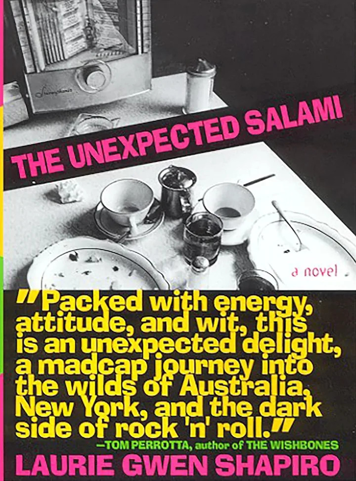 Book cover for "The Unexpected Salami" by Laurie Gwen Shapiro, featuring a table setting image. The cover highlights a novel's praise by Tom Perrotta