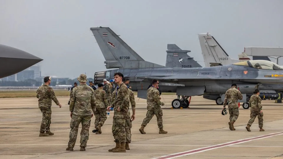 US Air Force personnel walk past planes on display at Thailand's 88th Royal Air Force Anniversary Air Show on March 7, 2025 in Bangkok, Thailand. - Lauren DeCicca/Getty Images