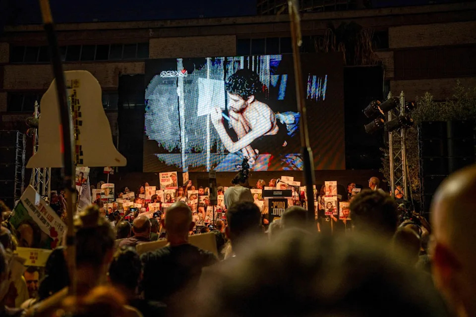 Families of hostages gather in Tel Aviv, Israel, on August 2, 2025, and watch a newly released video by Hamas showing Evyatar David, an Israeli hostage, in a severely malnourished condition. (Photo by ORI AVIRAM/Middle East Images/AFP via Getty Images)
