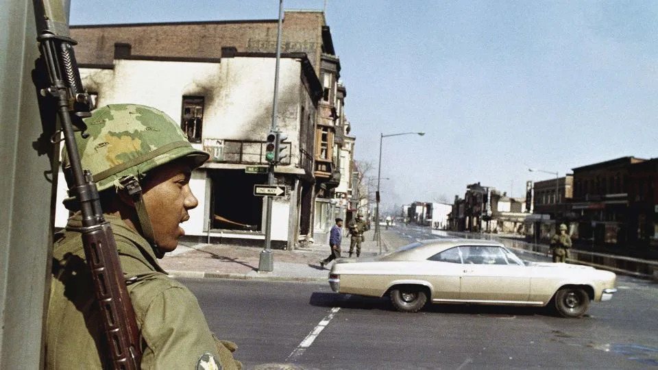 A National Guard soldier stands at the corner of 4th and H Streets in northeast Washington, DC, on April 6, 1968. - AP