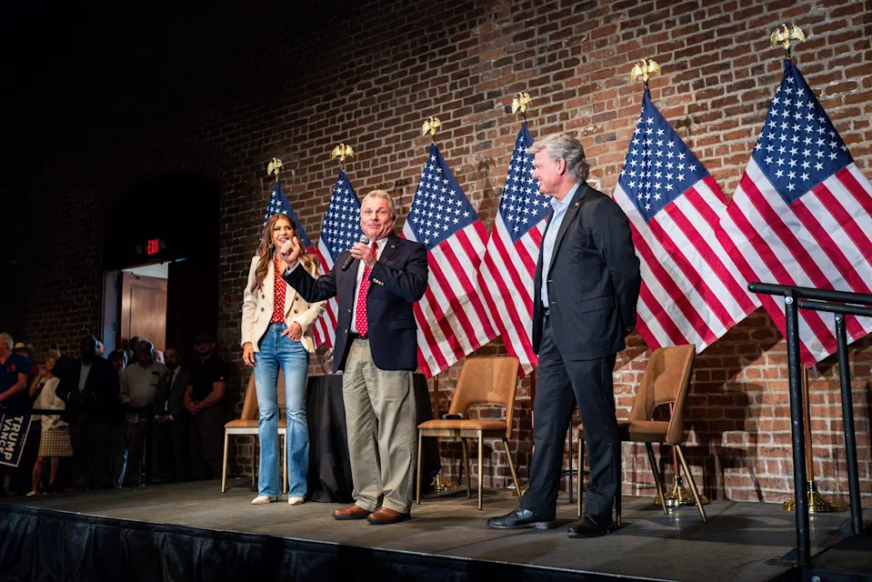 Then-South Dakota Gov. Kristi Noem campaigns with Georgia Republican Reps. Buddy Carter, center, and Mike Collins at a presidential reelection rally for Donald Trump in 2024 in Savannah, Georgia.