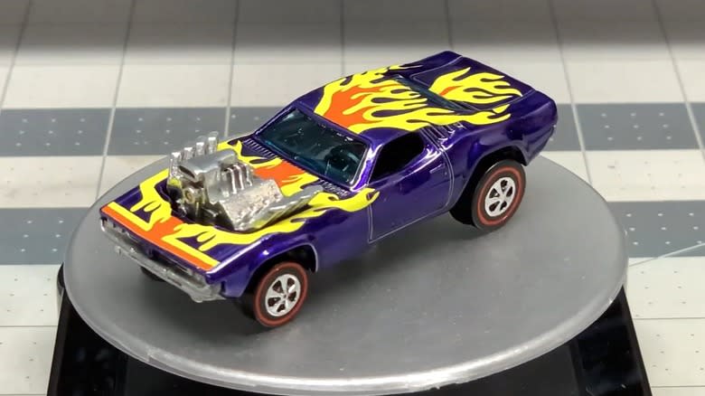 The blue 1974 Rodger Dodger on an orange Hot Wheels track.