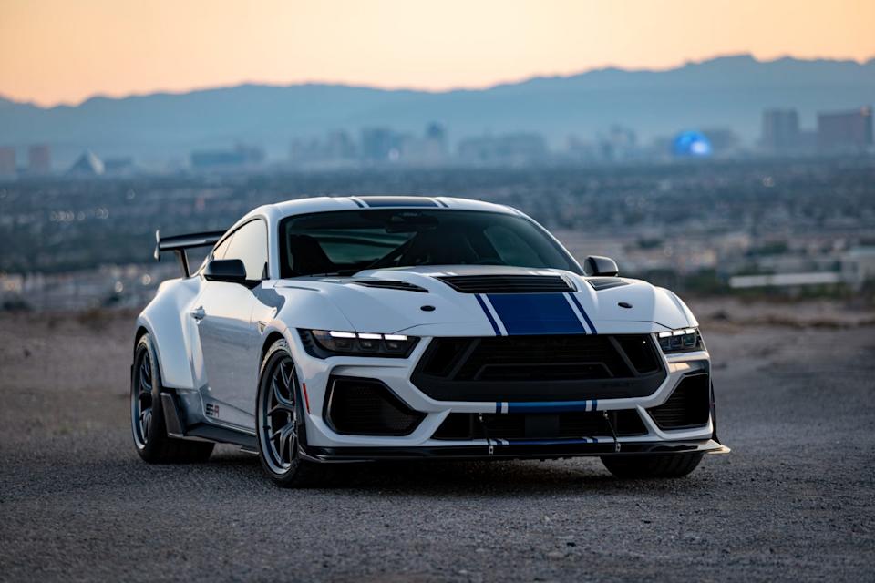 shelby american super snake r sports car positioned against a city skyline