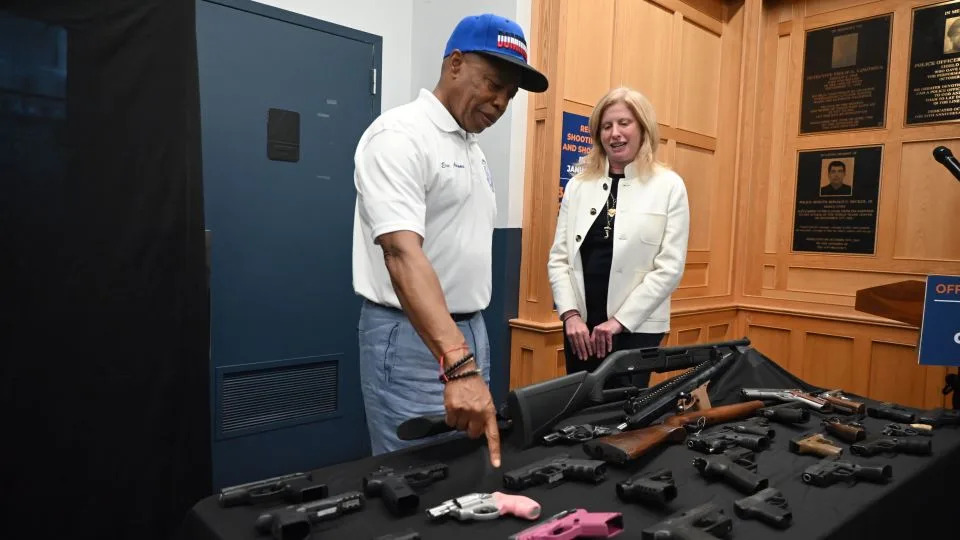 Mayor Eric Adams and New York Police Commissioner Jessica Tisch survey seized weapons before speaking with reporters in New York's Bronx borough on July 27. - Kyle Mazza/NurPhoto/Shutterstock