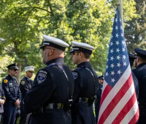 Two Herriman police officers stand in the ceremonial cordon during Tremonton-Garland police officer Eric Estrada’s funeral at the Logan City Cemetery on Thursday, Aug. 28, 2025. (Photo by Dayton Call for Utah News Dispatch)