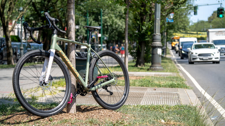 A green and white bicycle on a trail in New York City