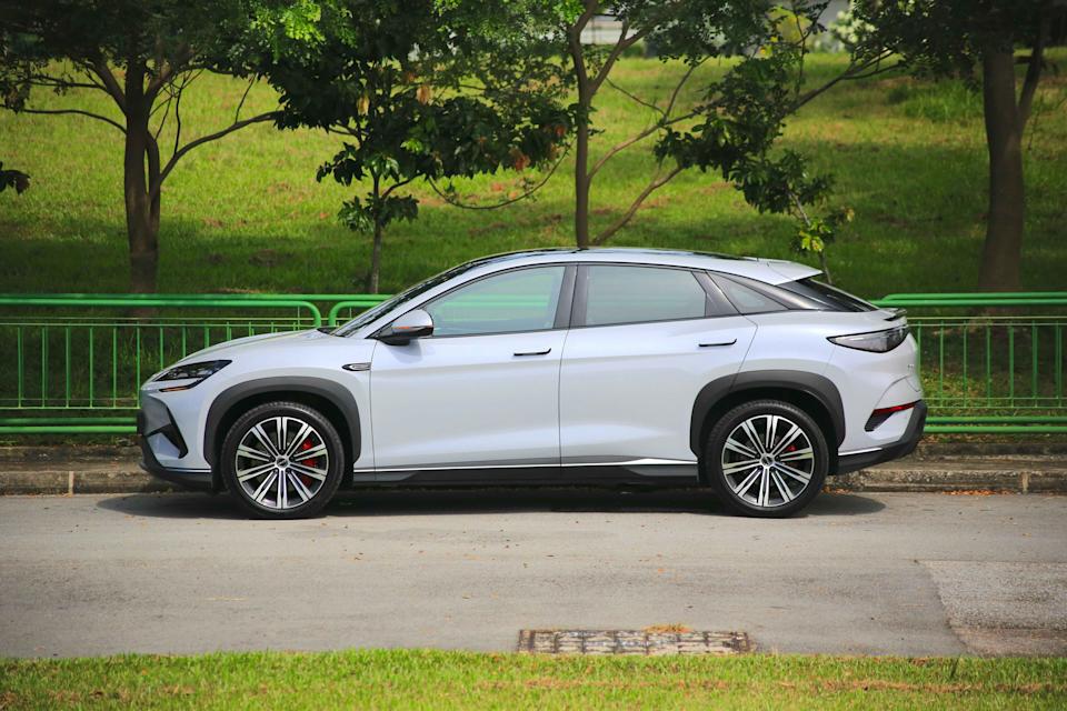 BYD Sealion 7 with a grassy hill in the background.