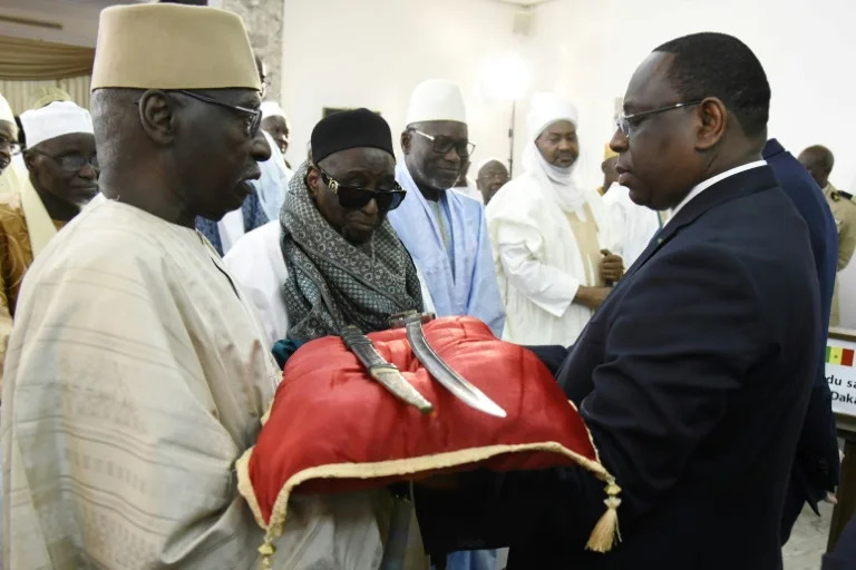 In 2019, France returned a 19-century sword to Senegal's then president Macky Sall (right) (SEYLLOU)